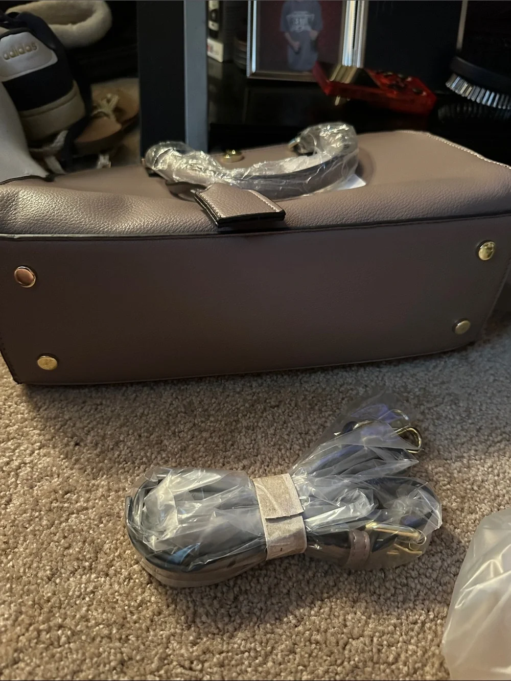 Gray purse with cross body strap